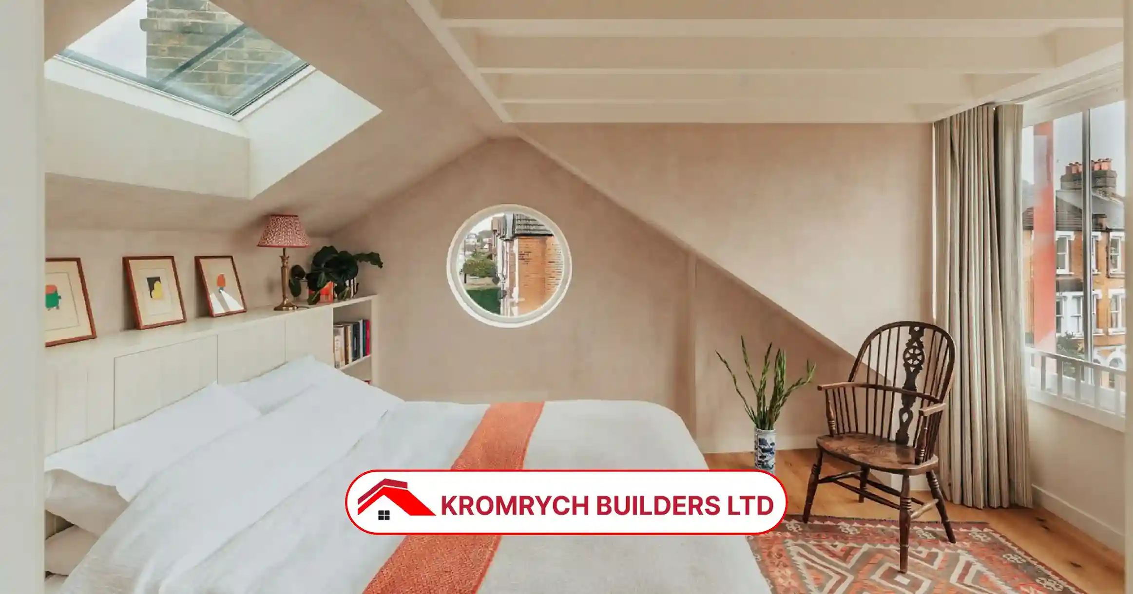 Modern dormer loft bedroom with skylight window, neutral walls, and cozy decor designed by Kromrych Builders Ltd.